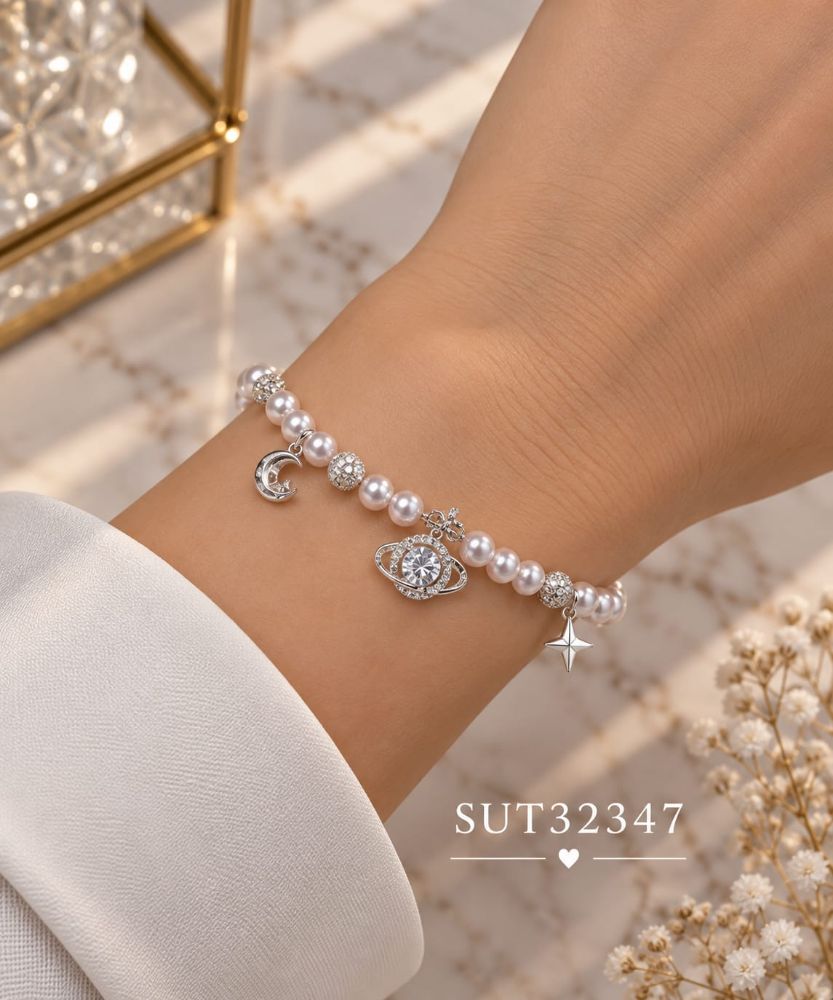 Imagen de PULSERA ACERO PERLAS ASTRO SUT32347